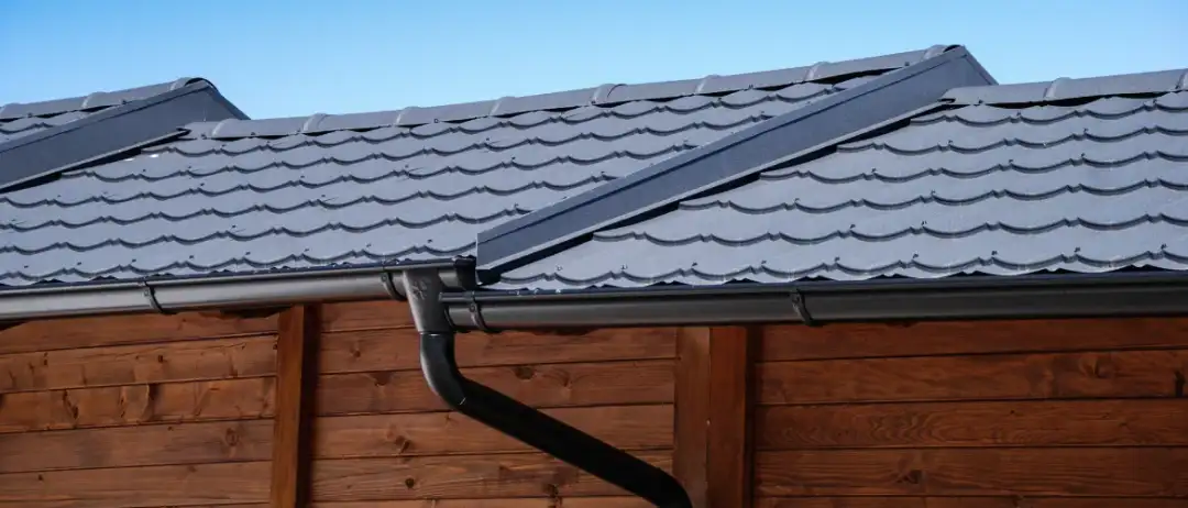 A completed T. Simpson Roofing project with new roofing and eavestroughs